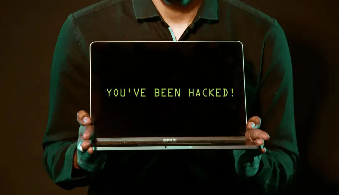 Laptop screen showing a you have been hacked warning